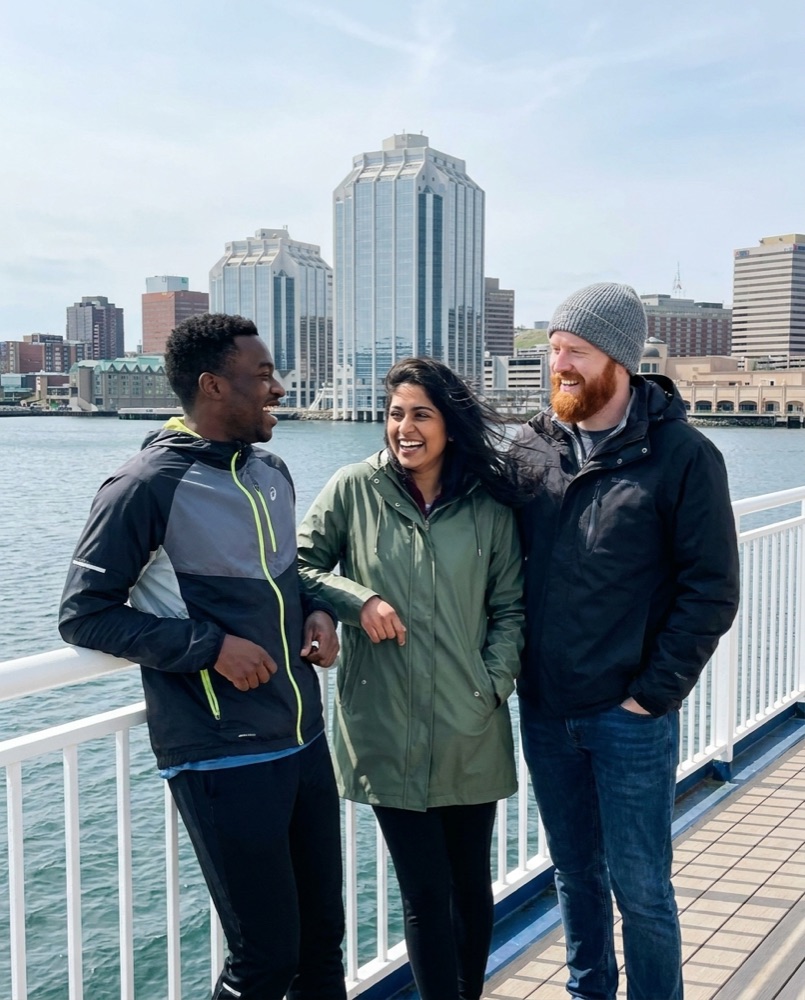 Three friends on the deck of the harbour ferry