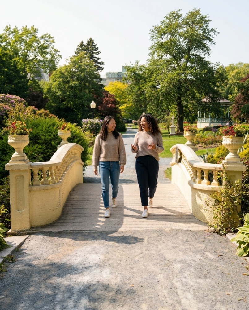 Two friends crossing the bridge in the Public Gardens
